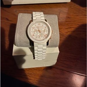 Michael Kors white rubber band watch with box.